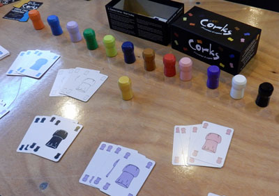Lots of brightly-coloured Corks! on display at the UK Games Expo