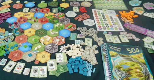 Terrain tiles, loads of bits and the thick rulebook of 504 on display at Spiel '15